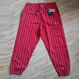 Karl Kani Small Signature Ziczac Pinstripe Relaxed Fit Sweatpants dark red/off white